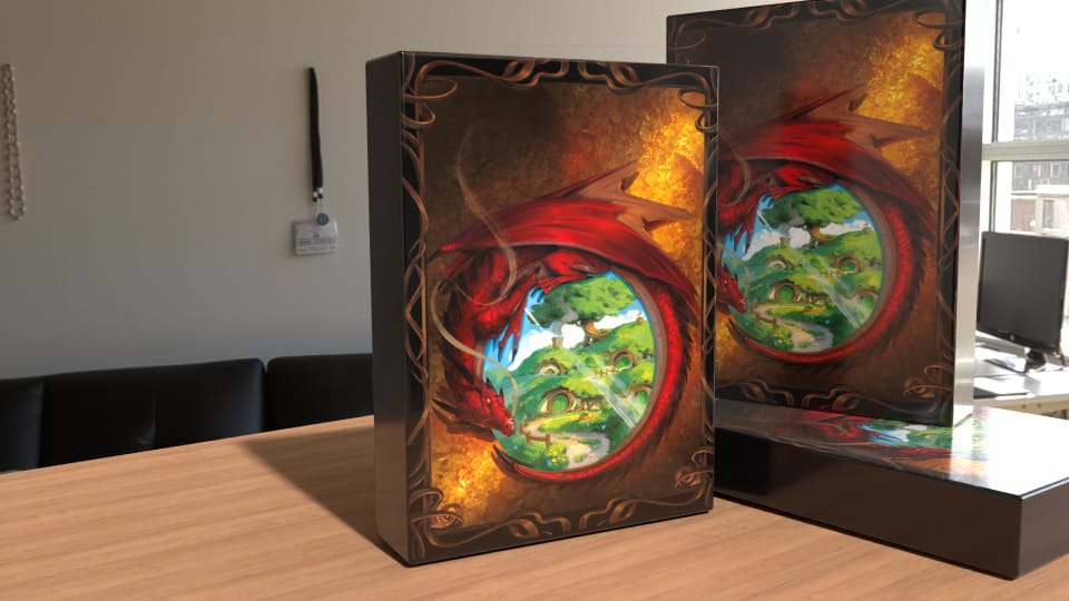 THE HOBBIT / LOTR Two rectangular boxes on a wooden desk featuring red dragon artwork around a green landscape scene.